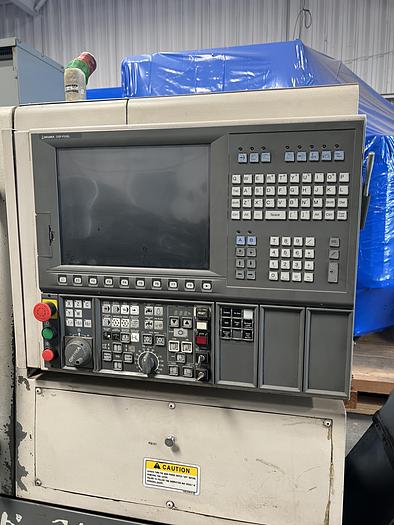 Used 2010 OKUMA Heritage ES-L10II CNC Turning Center With Edge Rebel 102 Bar Feeder