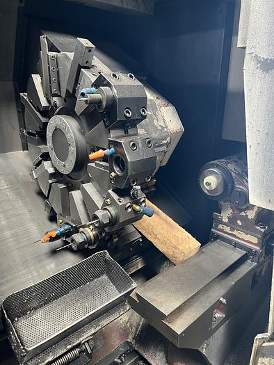 Used 2010 OKUMA Heritage ES-L10II CNC Turning Center With Edge Rebel 102 Bar Feeder