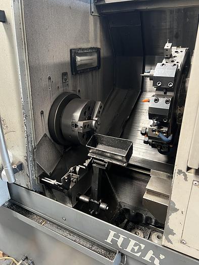 Used 2010 OKUMA Heritage ES-L10II CNC Turning Center With Edge Rebel 102 Bar Feeder