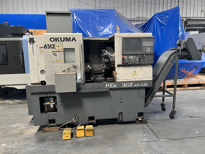 Used 2010 OKUMA Heritage ES-L10II CNC Turning Center With Edge Rebel 102 Bar Feeder