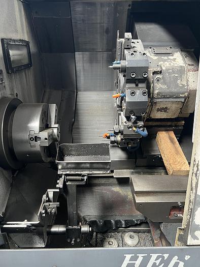 Used 2010 OKUMA Heritage ES-L10II CNC Turning Center With Edge Rebel 102 Bar Feeder