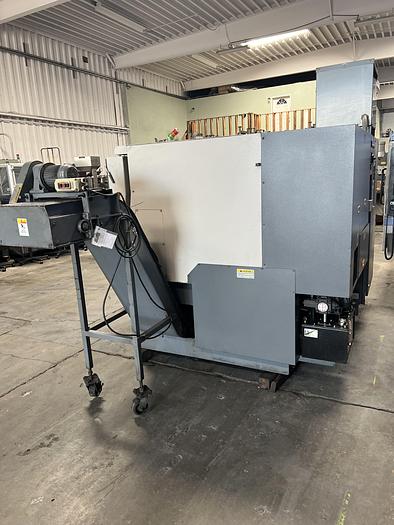 Used 2010 OKUMA Heritage ES-L10II CNC Turning Center With Edge Rebel 102 Bar Feeder