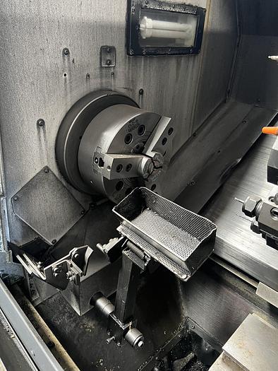 Used 2010 OKUMA Heritage ES-L10II CNC Turning Center With Edge Rebel 102 Bar Feeder