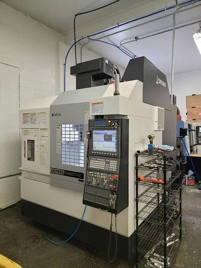 Used 2020 OKUMA Genos M460VE 4-Axis CNC Vertical Machining Center