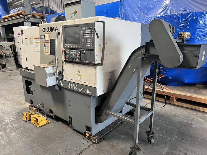 Used 2010 OKUMA Heritage ES-L10II CNC Turning Center With Edge Rebel 102 Bar Feeder