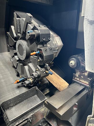 Used 2010 OKUMA Heritage ES-L10II CNC Turning Center With Edge Rebel 102 Bar Feeder