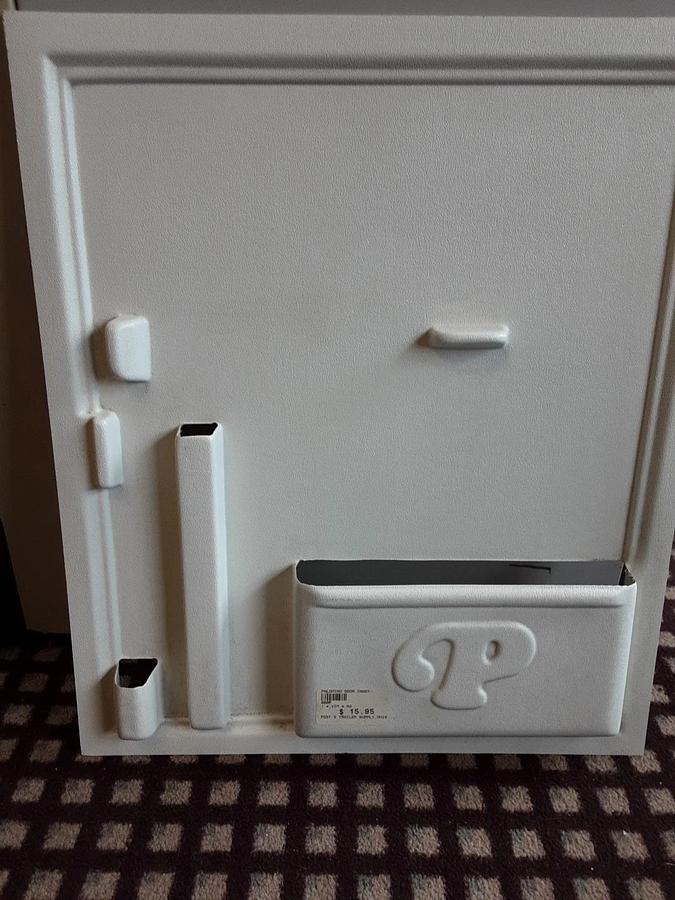 Palomino Entry Door With Storage Slots For Pop-ups.