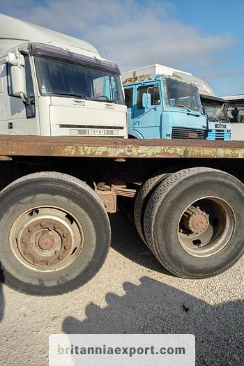 Used 1990 Iveco Turbostar 190-36 6X2 flatbed truck.