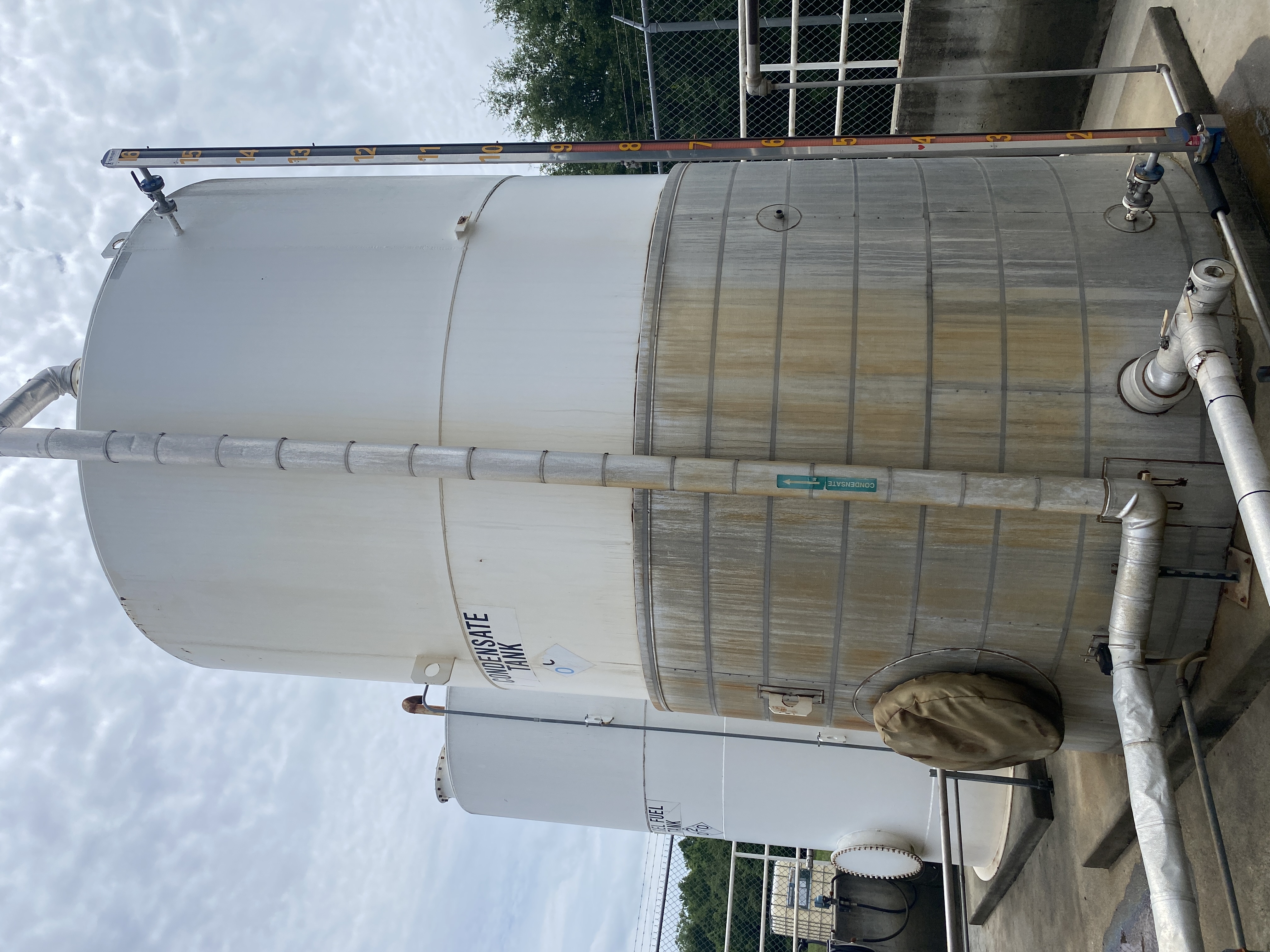 Used Used Highland Tank approximately 9500 gallon vertical carbon steel condensate tank.