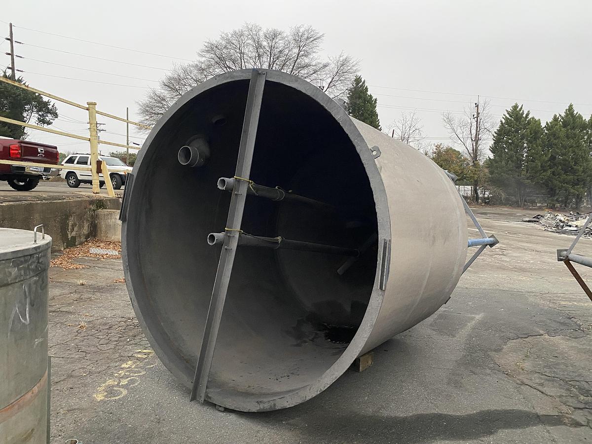 Used (2) Used approximately 3000 gallon fiberglass cone bottom tanks