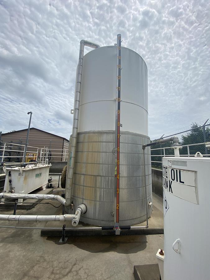 Used Used Highland Tank approximately 9500 gallon vertical carbon steel condensate tank.