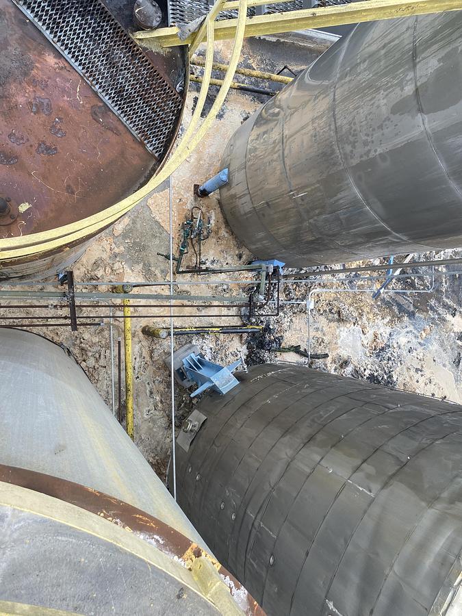 Used Used Industrial Air Inc. approximately 10,000 gallon stainless steel agitated storage tank with internal coils