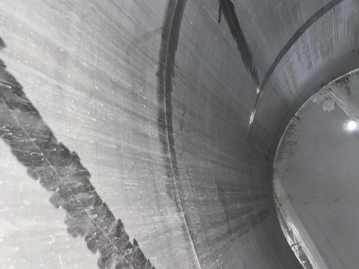 Used Used Wolfe Mechanical approximately 10,000 gallon 304L stainless steel vertical tank
