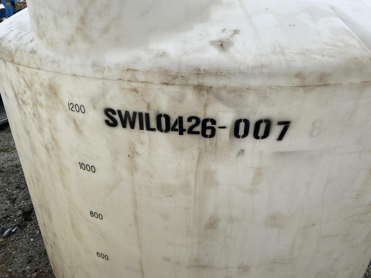 Used Used Norwesco 1550 gallon Polyethylene vertical storage tank.