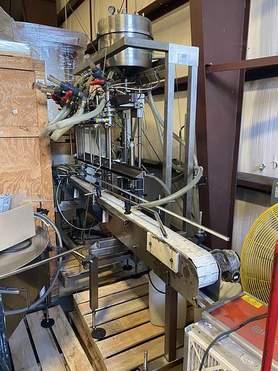 Used Used E-Pak 6 Head automatic pressure gravity filler