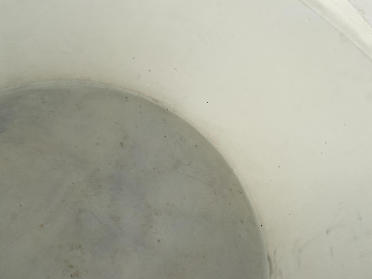 Used Used Norwesco 1550 gallon Polyethylene vertical storage tank.