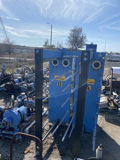 Used Used Tranter Supercharger approximately 563.60 sq ft stainless steel plate heat exchanger