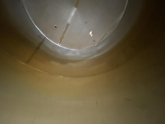 Used Used Wolfe Mechanical approximately 10,000 gallon 304L stainless steel vertical tank