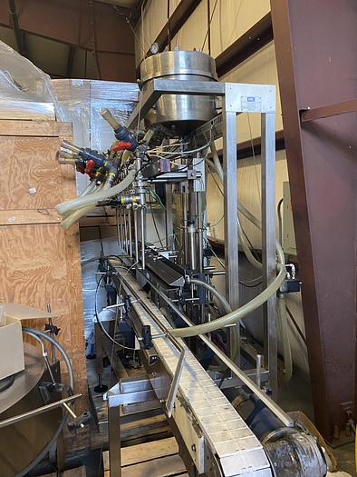 Used Used E-Pak 6 Head automatic pressure gravity filler