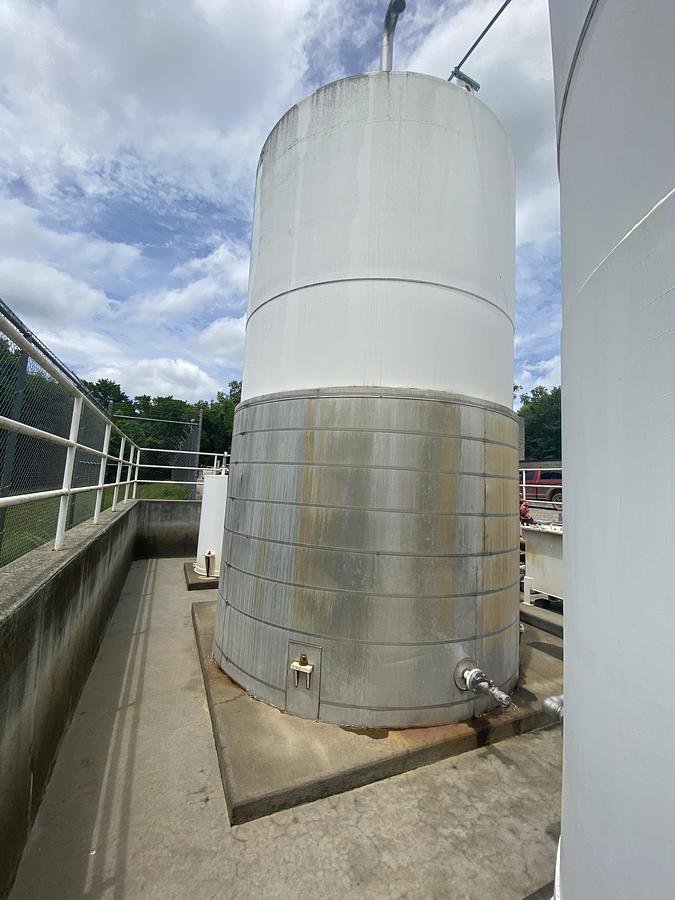 Used Used Highland Tank approximately 9500 gallon vertical carbon steel condensate tank.