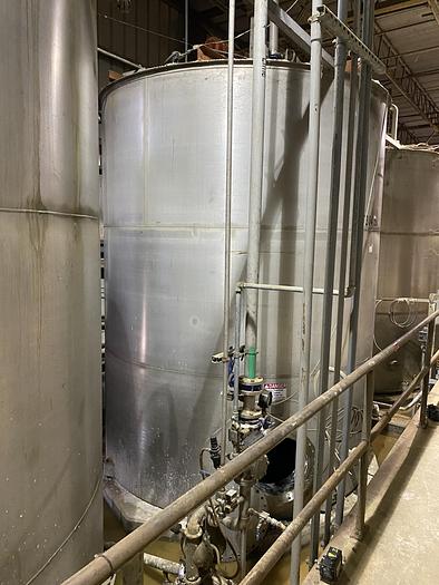 Used Used Wolfe Mechanical approximately 12,600 gallon 304L stainless steel vertical mix tank