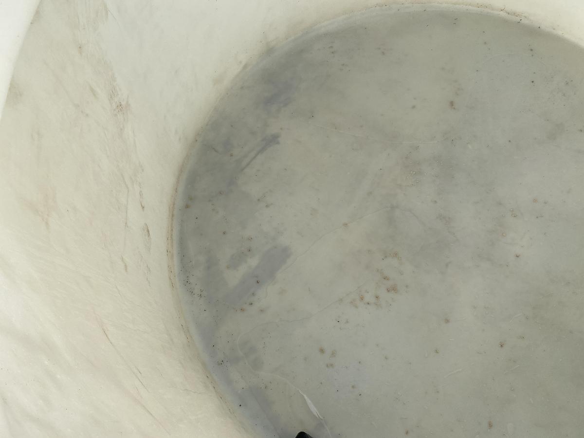 Used Used Norwesco 1550 gallon Polyethylene vertical storage tank.