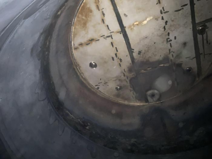 Used Used Wolfe Mechanical approximately 12,600 gallon 304L stainless steel vertical tank