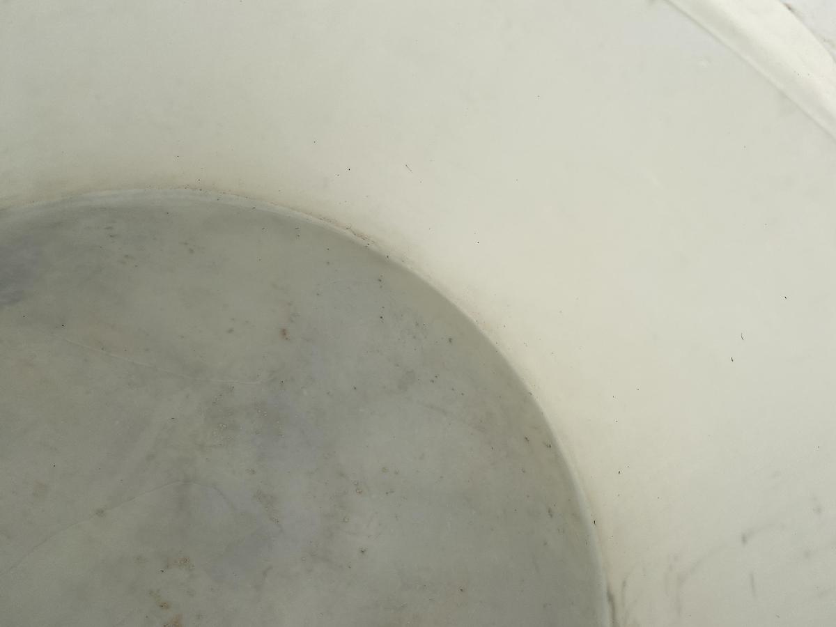 Used Used Norwesco 1550 gallon Polyethylene vertical storage tank.