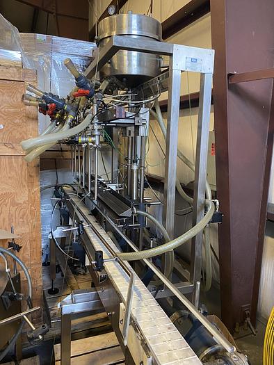 Used Used E-Pak 6 Head automatic pressure gravity filler