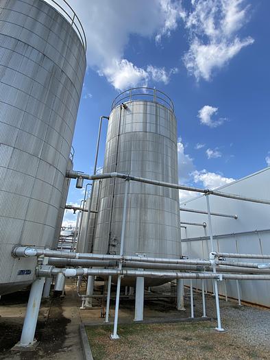 Used Used Bendel approximately 39,700 gallon 304 stainless steel vertical storage tank.