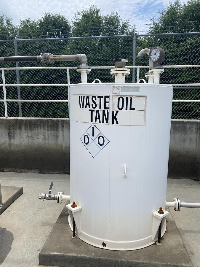 Used Used Highland Tank approximately 500 gallon vertical carbon steel waste oil tank.