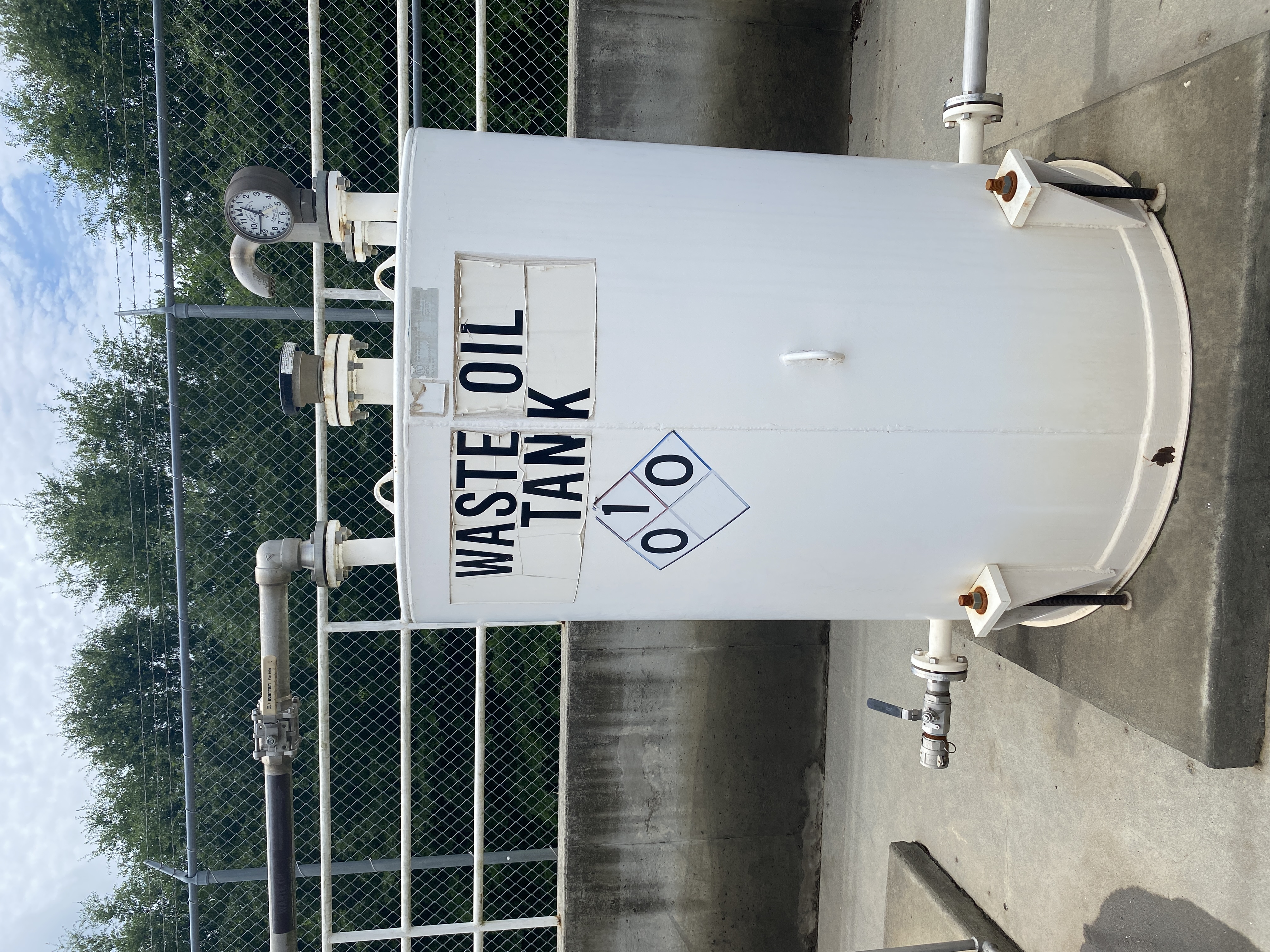 Used Used Highland Tank approximately 500 gallon vertical carbon steel waste oil tank.