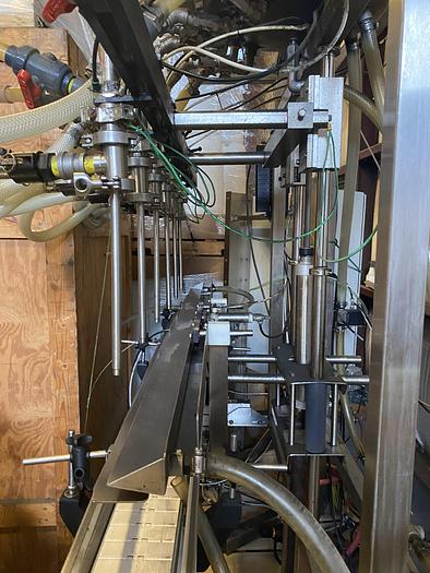 Used Used E-Pak 6 Head automatic pressure gravity filler