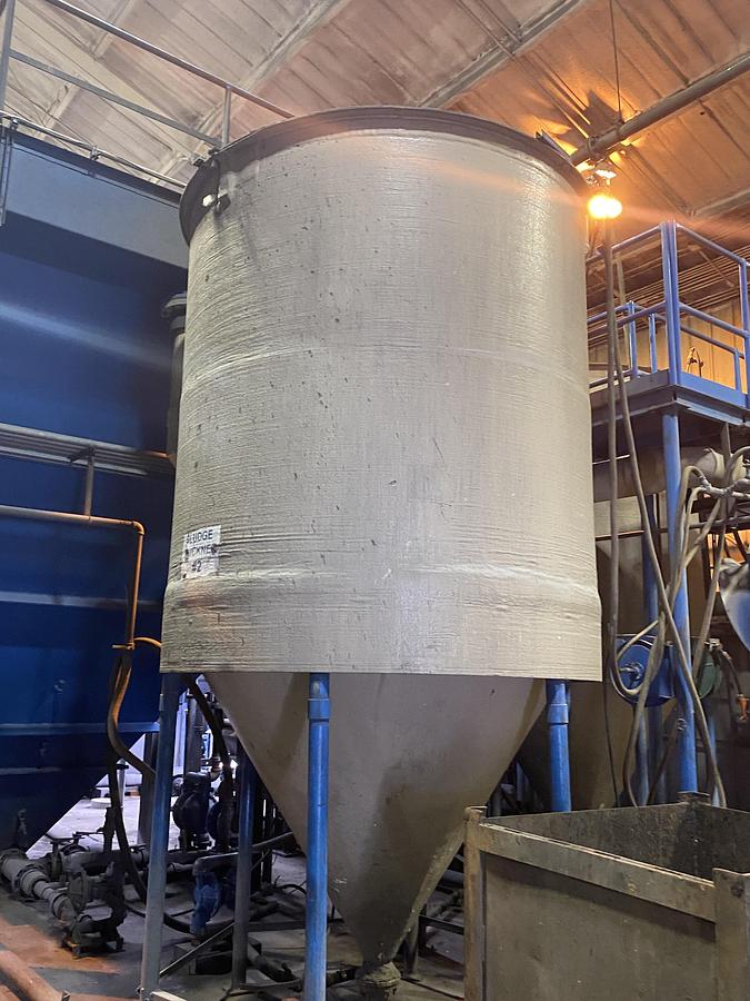 Used (2) Used approximately 3000 gallon fiberglass cone bottom tanks