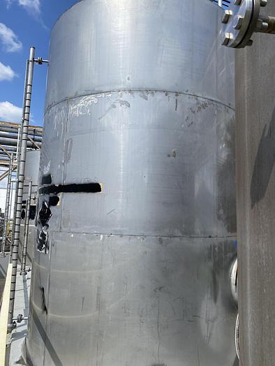 Used Used approximately 8000 gallon vertical stainless steel storage tank.
