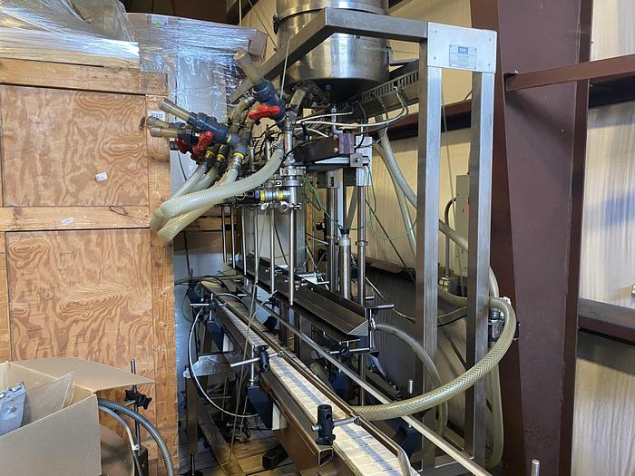Used Used E-Pak 6 Head automatic pressure gravity filler