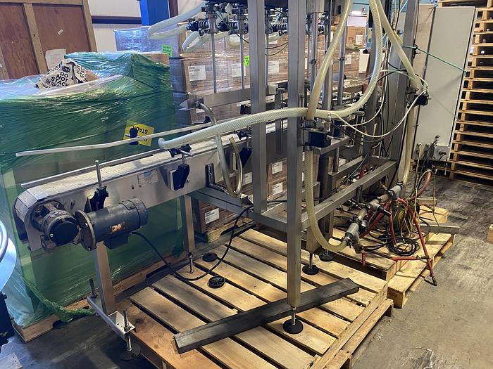 Used Used E-Pak 6 Head automatic pressure gravity filler