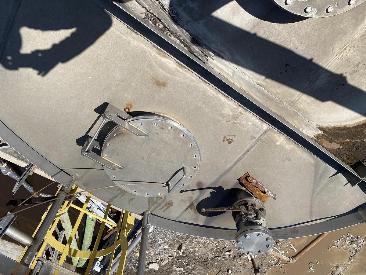 Used Used Knight Fabrication approximately 14,000 gallon stainless steel vertical tank