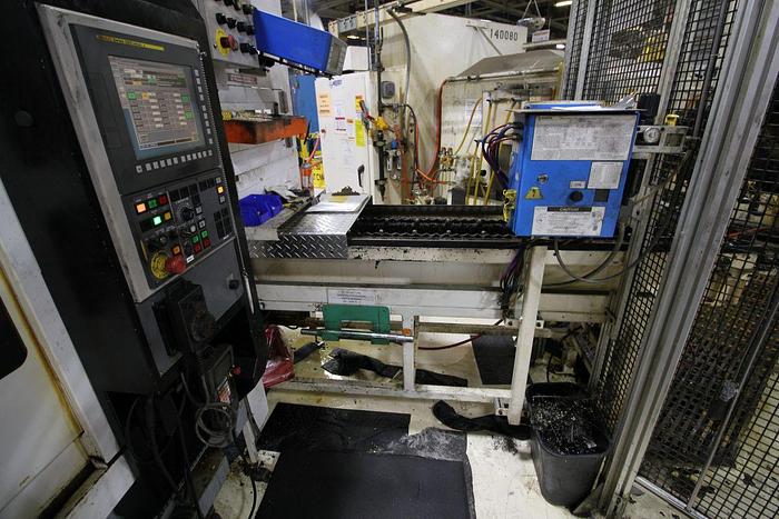 Used FUJI ANS-320TTS TWIN TURRET CNC LATHE WITH ROBOT LOAD/UNLOAD AND STOCKER TABLES