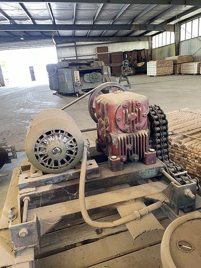 Used Mellott 3 Strand Log Deck with drive and Stop and Loader