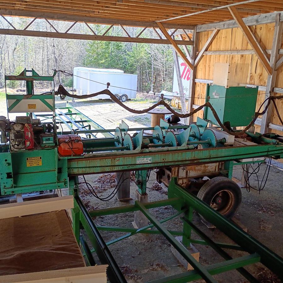 Used Select Sawmill with, Rosserhead style Debarker, log deck and green chain, Mill is a 6” double cut band for seamless back and forth Sawing for logs up to 42” x 22’ long.