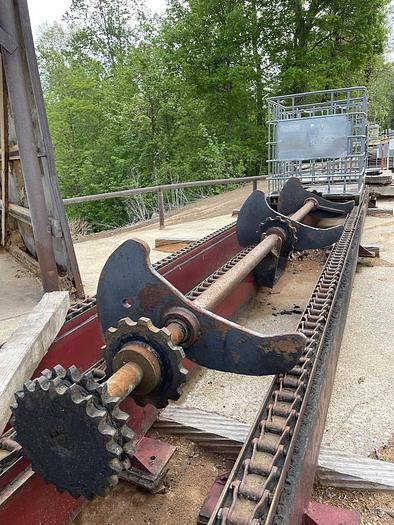 Used Mellott 3 Strand Log Deck with drive and Stop and Loader