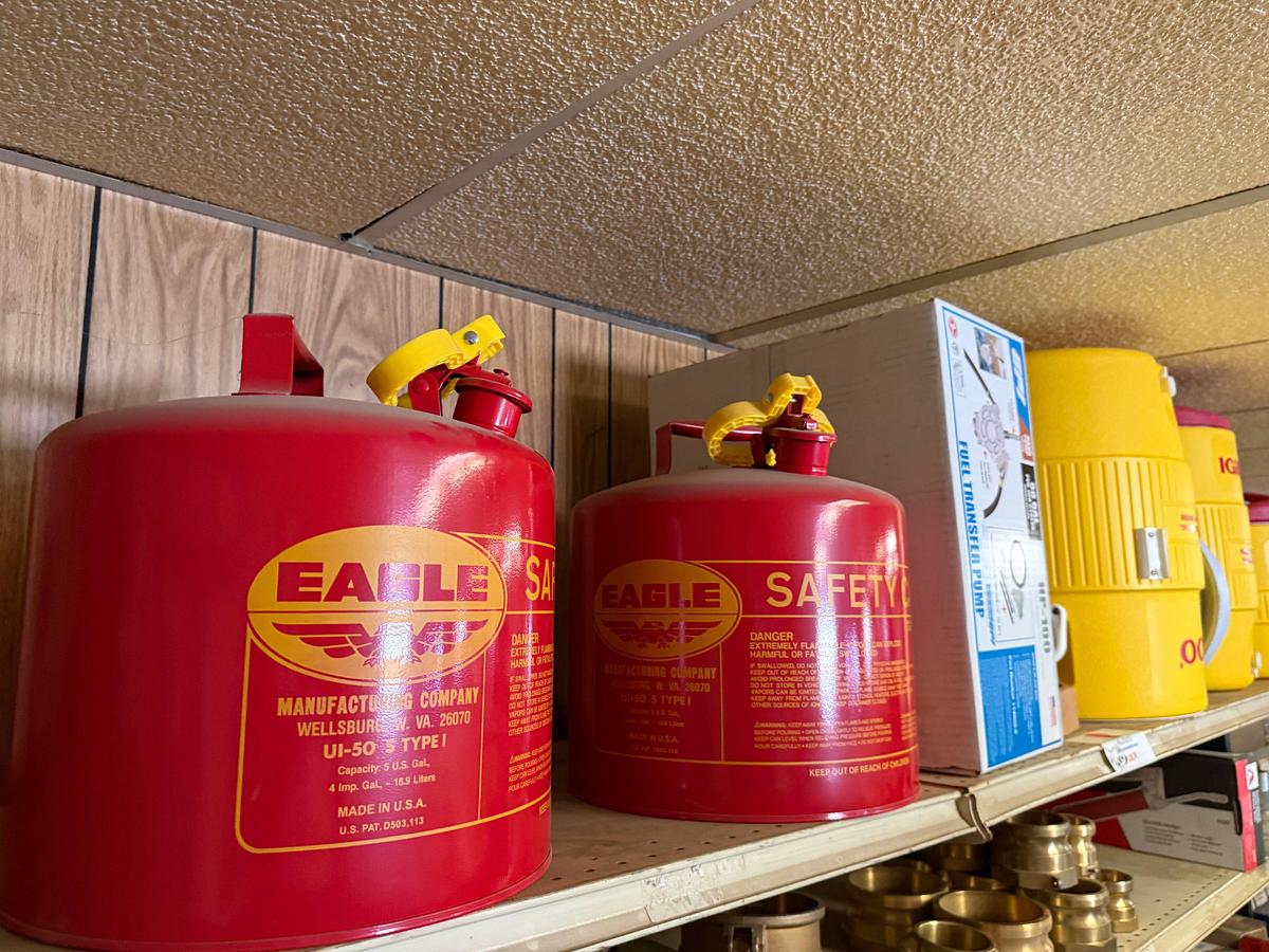 Used TOP SHELF W/ (3) 10-GAL IGLOO DRINKING COOLERS, (1) GPI ALUM HP-100 HAND PUMP, (2)EAGEL 5-GAL. SAFETY CANs