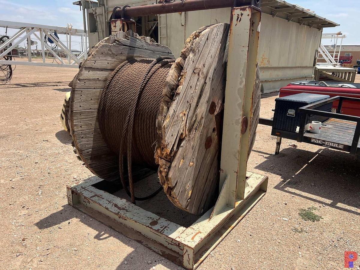 Used SPOOL STAND WITH 5’6” DIAMETER SPOOL 1/4 FULL OF 1” DRILL LINE