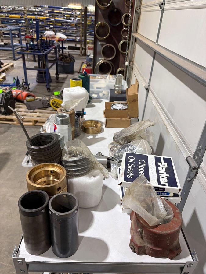 Used Shelving unit w/ (UNUSED) XK-90 & Logan swivel parts, stabbing guides, Kelly valve kits, guages, etc