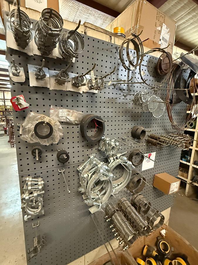 Used END CAP SECTION OF (50+) ZSPEC 2” FIG 100 PIPE UNIONS & PEG BOARD W/ VARIOUS STEEL CLAMPS