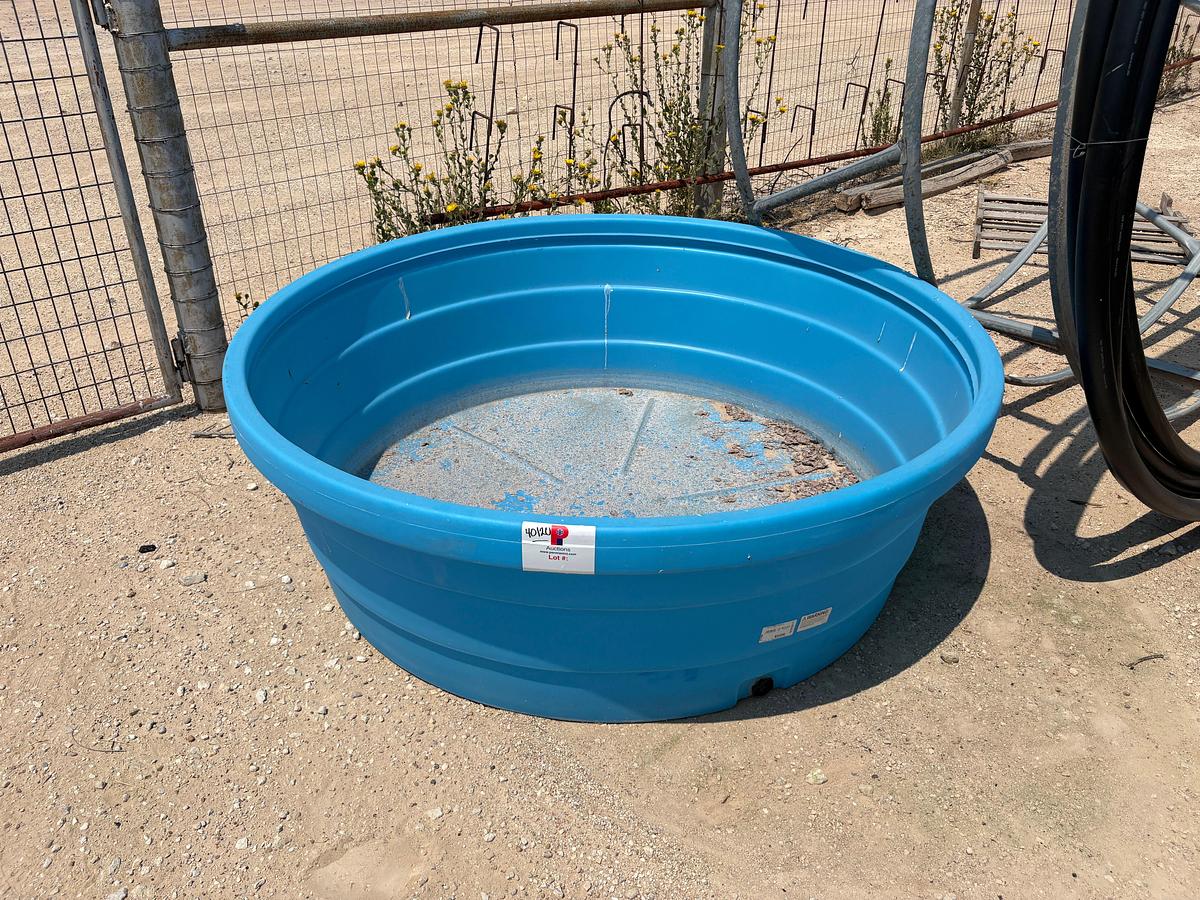 Used 6’ x 2’ flex poly stock tank, poly-pipe hay ring & round bale feeder
