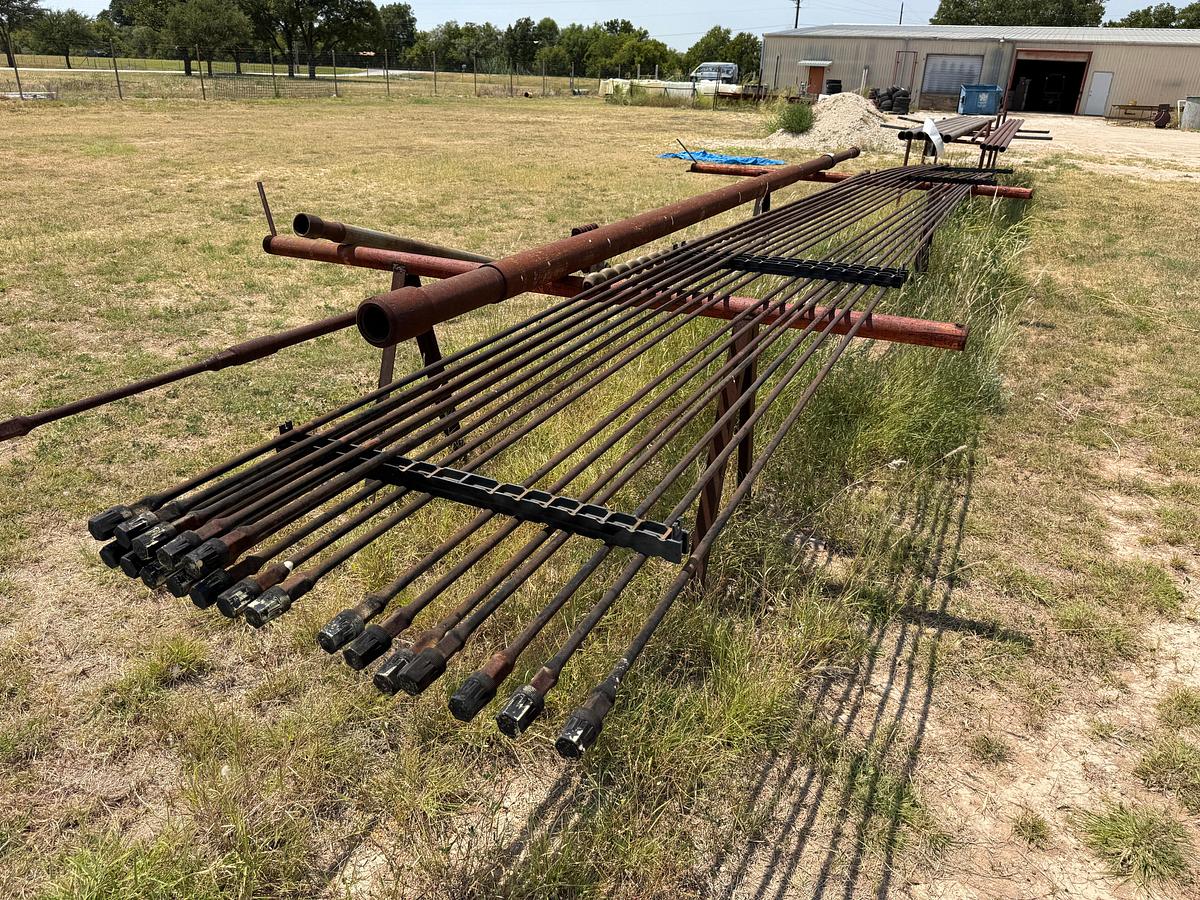 Used LOT W/ (19) UNUSED 5/8” x 25’ SUCKER RODS & (2) PIPE RACKS
