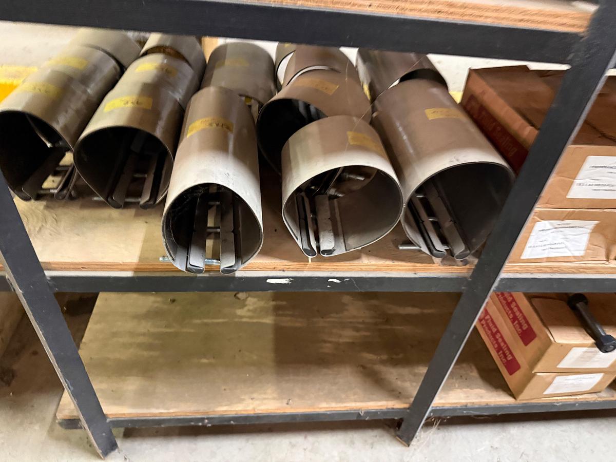 Used 5-SHELF RACK W/ CONTENTS OF PVC BALL VALVES & UNIONS, NETCO COLLAR LEAK REPAIR CLAMPS, (14+) BOXES 5/8” THRU 1” STUDS & NUTS