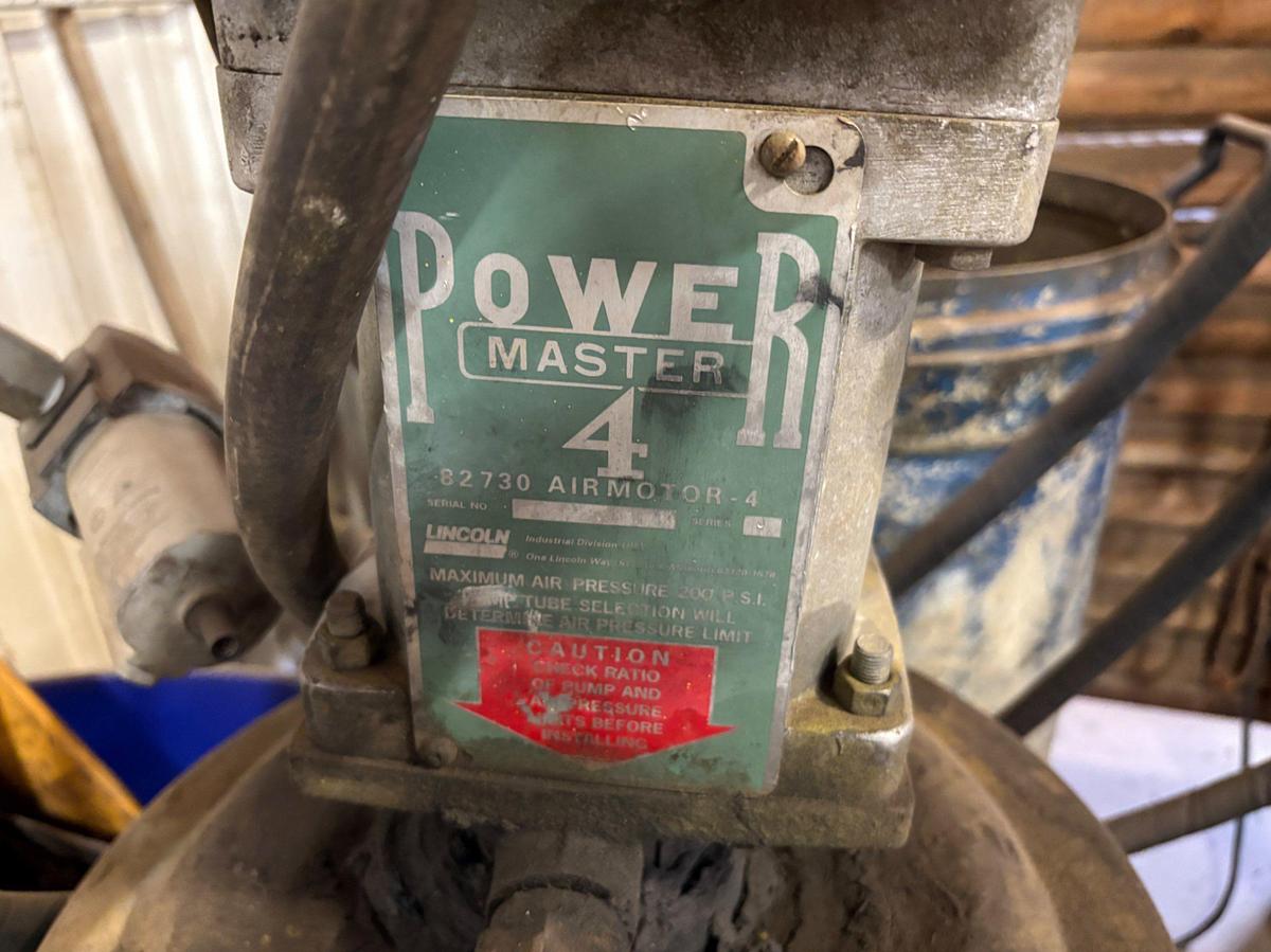Used Lincoln power master 4 air motor/grease pump w/ (2) barrels of high temp grease